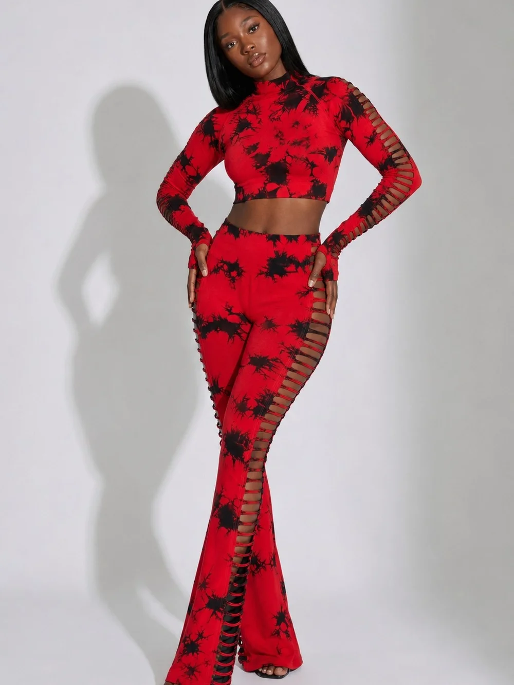 SHEIN Red & Black Tie-Dye Ladder Cutout Flare Pants - Picture 1 of 2